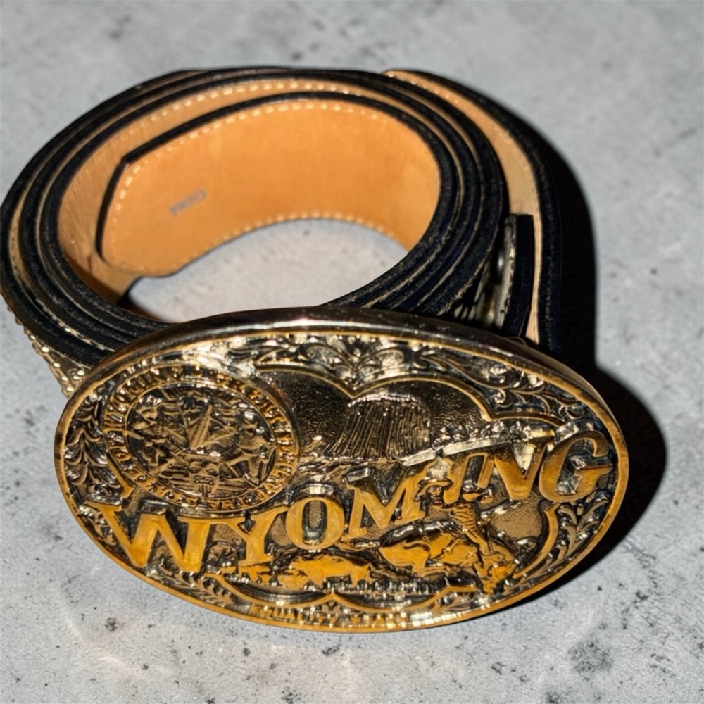 Justin Boots Gold and Black Wyoming Belt and Montana Silversmith buckle